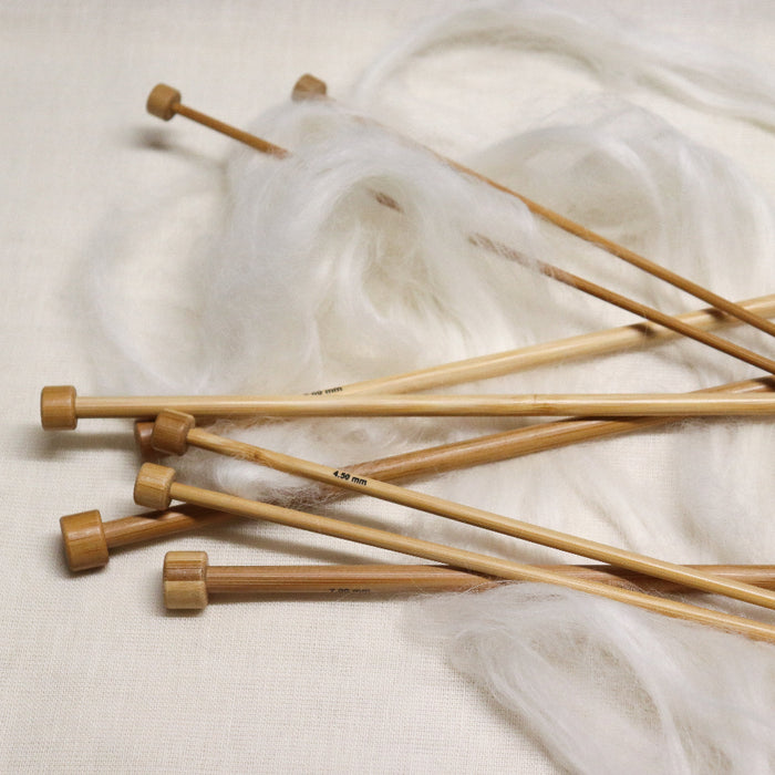 Phoenix gold bamboo straight knitting needles with sizes printed on.