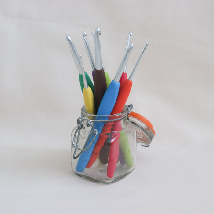 colour coded amour crochet hooks in a jar