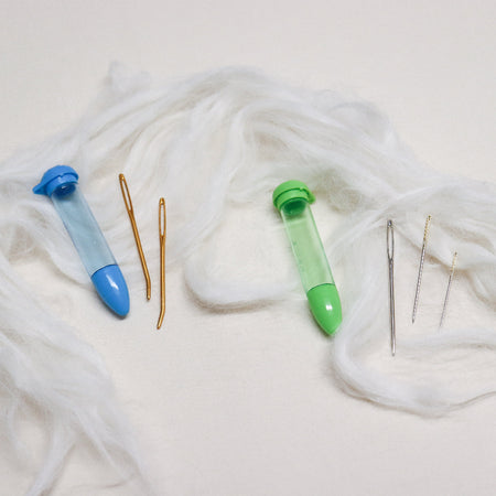 piece clover darning needles and plastic storage tube.