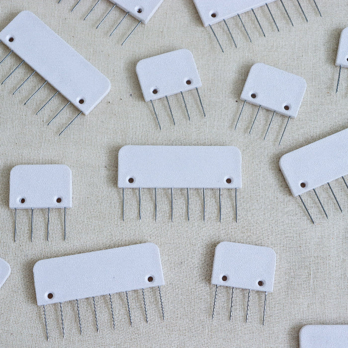 knitpro knit blockers in white plastic with metal pins.