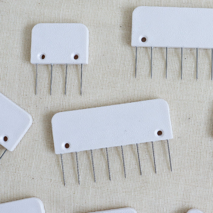 knitpro knit blockers in white plastic with metal pins.