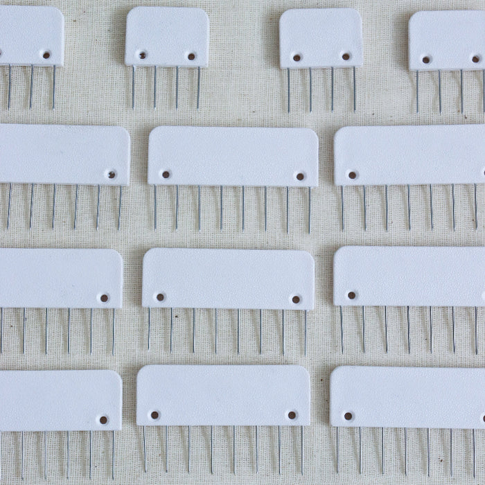 knitpro knit blockers in white plastic with metal pins.