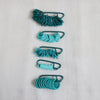 knitpro mindful collection teal stitch markers in 5 different shapes and styles.