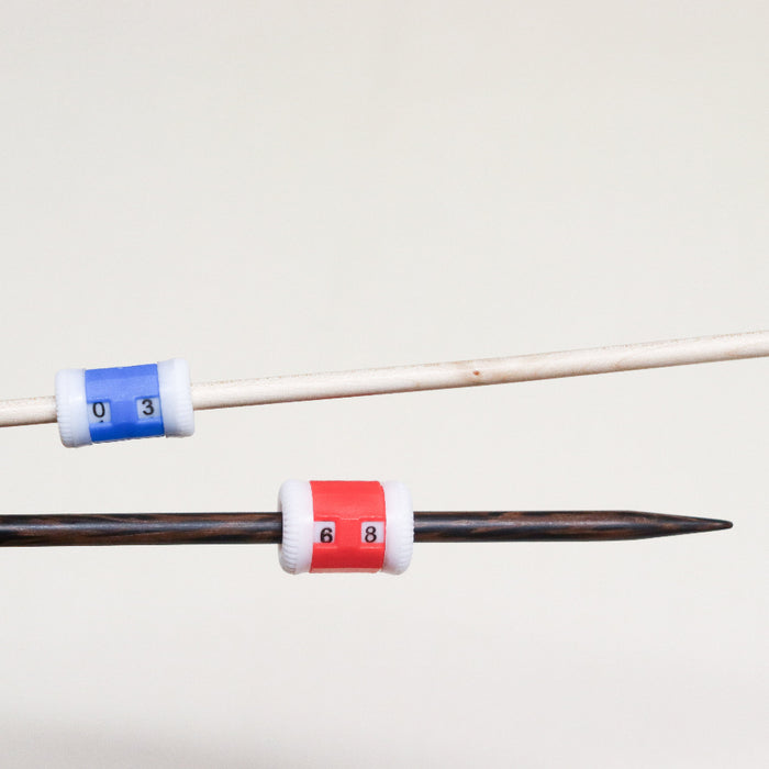 knitpro plastic row counters in small and large on knitting needles.